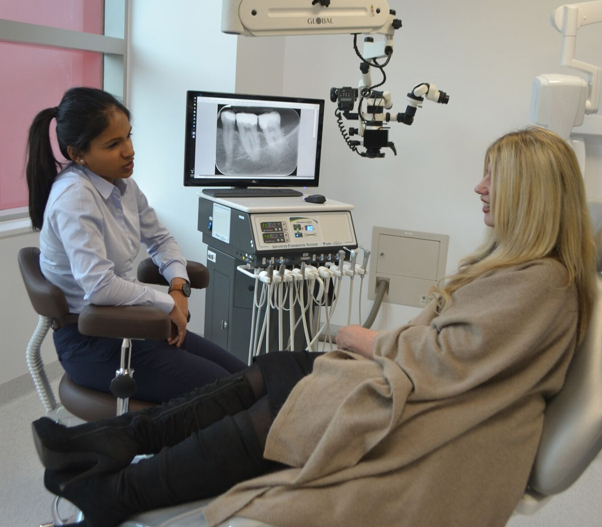 Female Patient and Dr Yoganathan Patient Consulting Dr Yoganathan for Apicoectomy Surgery - Australian Dental Specialist